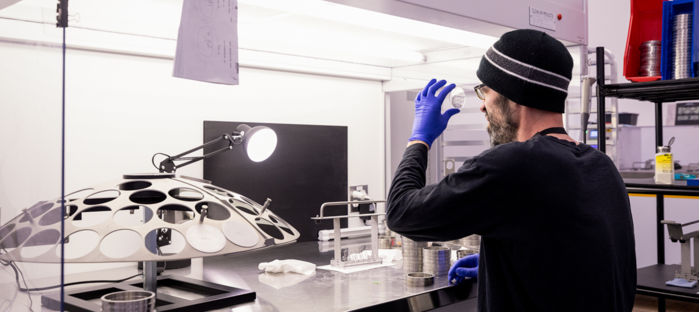 Smith glasses lens being inspected by a lab technician. 